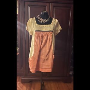 Organic, see through blouse with deep side pockets will pair well with leggings